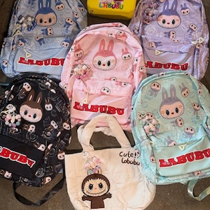 Labubu School Size Backpacks with handmade keychain embellishments, puffer tote and  makeup case with handmade embellishments