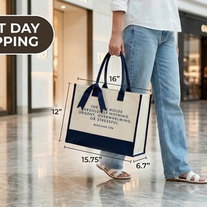 Tote bag design featuring a humorous quote reading the bag holds absolutely nothing urgent overwhelming or stressful displayed in bold uppercase lettering with a clean and centered layout; includes a small retired life phrase underneath for added personality; designed with a minimal modern style that highlights the text clearly; ideal for retirement gifts, everyday use, or carrying essentials with a lighthearted and relaxed vibe