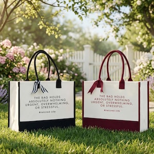 Tote bag design featuring a humorous quote reading the bag holds absolutely nothing urgent overwhelming or stressful displayed in bold uppercase lettering with a clean and centered layout; includes a small retired life phrase underneath for added personality; designed with a minimal modern style that highlights the text clearly; ideal for retirement gifts, everyday use, or carrying essentials with a lighthearted and relaxed vibe
