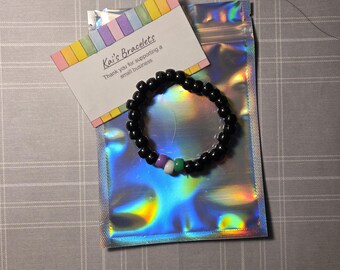 Pulseira de contas estranhas