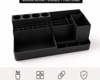 May include: A black multifunctional organizer featuring multiple compartments of varying sizes, including four circular slots, a grid section, and several rectangular bins. The text MULTIFUNCTIONAL ORGANIZER, MODERN DESIGN, DURABLE, FUNCTIONAL is visible.