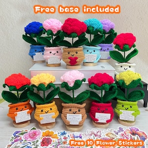 May include: A collection of colorful, crocheted flower plants in smiling pots. The flowers are in various colors, including blue, pink, red, and yellow. Each pot has a wooden base and a small tag with text. The image also includes flower stickers.