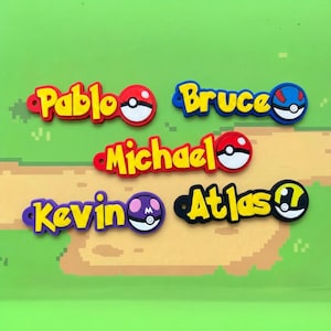 May include: Colorful name tags with the names "Pablo", "Bruce", "Michael", "Kevin", and "Atlas" in yellow lettering. Each tag features a cartoon-style design, with a red, blue, purple, or black background and a matching cartoon ball.
