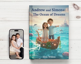 May include: A children's book titled "Andrew and Simona: The Ocean of Dreams" with an illustration of two children in a boat on the ocean. A smartphone displays a photo of two children. The book cover features dolphins and a castle.