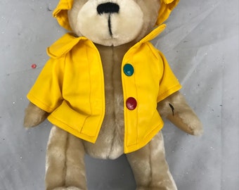 teddy bear in yellow raincoat