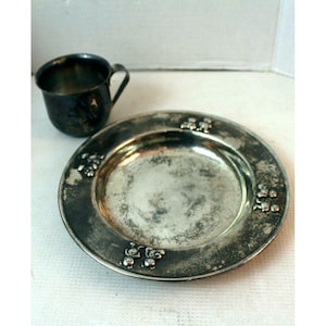 silver plated childs cup and plate with teddy bear design