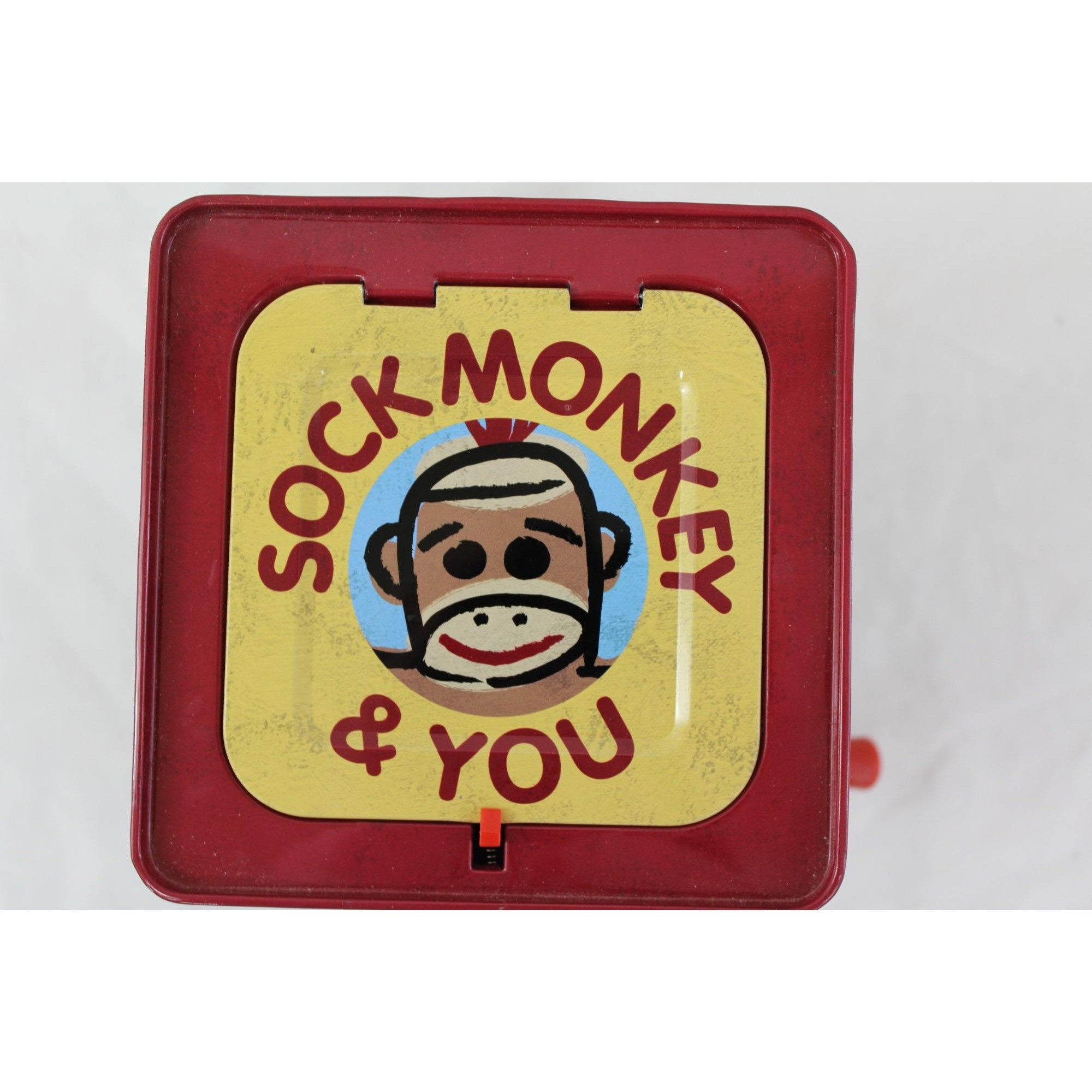 Sock monkey jack in the cheap box