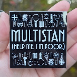 May include: A black square sticker with white text and illustrations. The word "MULTISTAN" is prominently displayed, with the phrase "(HELP ME. I'M POOR.)" below it. The sticker features various stylized illustrations.