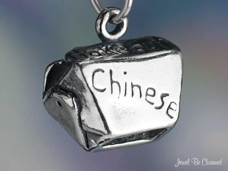 May include: Silver charm in the shape of a Chinese takeout box with the word "Chinese" inscribed on the front.