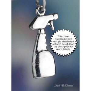 May include: Silver charm in the shape of a spray bottle. The charm is available with multiple attachment options. The text "This charm is available with multiple attachment options! Scroll down the description for more details." is printed on a white starburst.