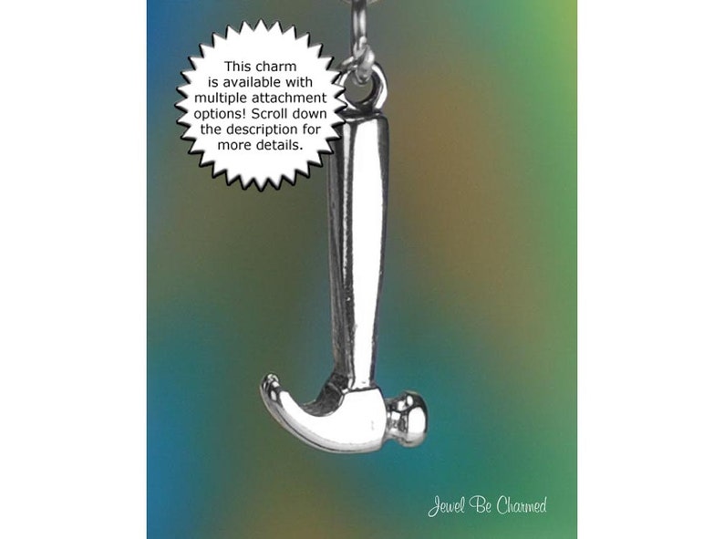 May include: A silver-colored hammer charm suspended from a chain. The charm has a detailed design and is set against a gradient background of blue, green, and yellow. Text on the image states the charm has multiple attachment options.