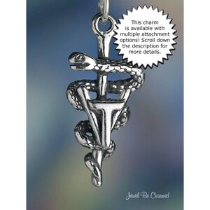 May include: A silver-colored charm featuring the Rod of Asclepius, a symbol of medicine, with a serpent coiled around a staff. The charm has a detailed design and includes the text: "This charm is available with multiple attachment options! Scroll down the description for more details."