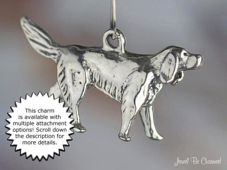 May include: Silver charm of a dog, possibly a pointer breed, in a walking pose. The charm is available with multiple attachment options.