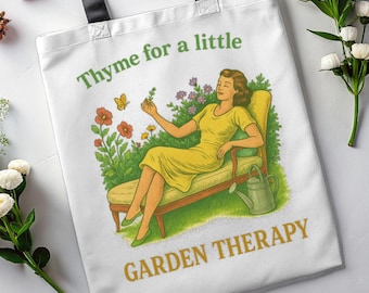 May include: White tote bag with black handles featuring a vintage illustration. The image shows a woman in a yellow dress relaxing in a garden, with the text "Thyme for a little GARDEN THERAPY".