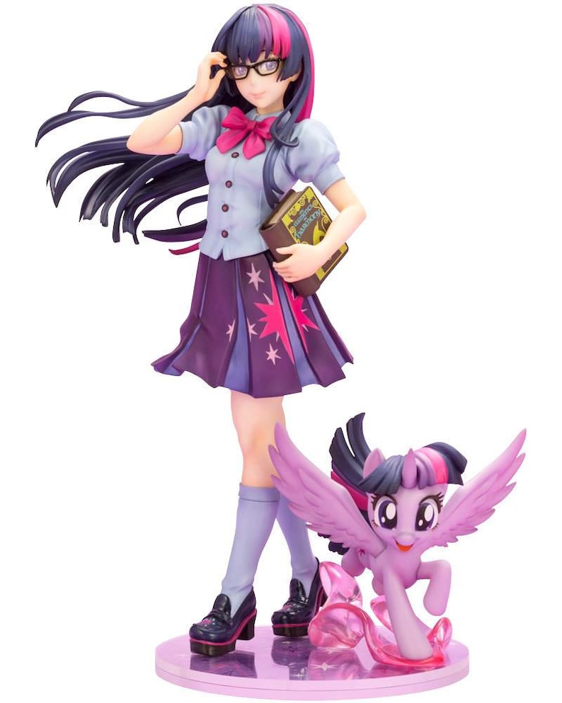 May include: A purple and pink anime figurine of Twilight Sparkle from My Little Pony: Friendship is Magic. She is wearing a blue and white school uniform with a purple skirt and a pink bow. She is holding a book and wearing glasses. A smaller purple and pink pony figurine of Twilight Sparkle is running next to her.