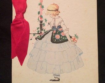Vintage 1920's Christmas Card - Girl in Ruffled Dress holding Gift  - Candle - Greeting Card - Paper Ephemera