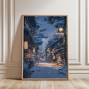 May include: Framed print of a snowy Japanese street scene. The artwork depicts traditional buildings with lit lanterns and shops along a snow-covered road. The color palette is dominated by blues, whites, and warm light from the lanterns, creating a serene winter atmosphere.