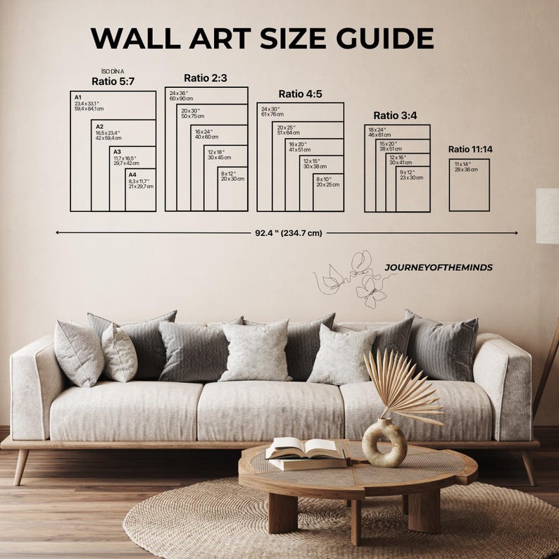 May include: Wall art size guide with dimensions in inches and centimeters. The guide includes ratios 5:7, 2:3, 4:5, 3:4, and 11:14, with sizes ranging from 8x10 inches to 24x36 inches. A sofa, coffee table, and decorative items are in the foreground.