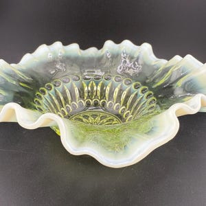 Antique uranium Vaseline opalescent glass bowl with a ruffled edge