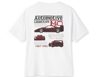 May include: White t-shirt featuring a graphic of a red Ferrari F40 with the text "Automotive Collective F40" and the years "1987-1992". The design includes multiple views of the car.