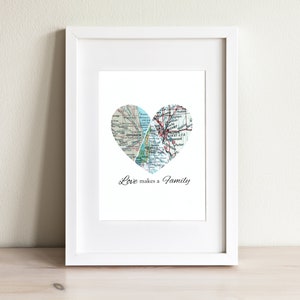 May include: A framed print with a heart shape made of vintage maps of Chicago, Seattle, and Denver. The text "Love makes a family" is printed below the heart.