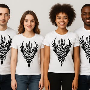 May include: Four people wearing white t-shirts with a black tribal design. The design features a symmetrical winged emblem with feather details. The shirts are short-sleeved and the people are standing in front of a white background.