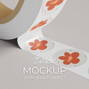 May include: A roll of white stickers with a floral design in orange and the word "Bocelle" in cursive. The stickers are round and have the text "MADE WITH LOVE" and "100% ETHICAL FASHION". The word "Sticker" and "MOCKUP" are also visible.