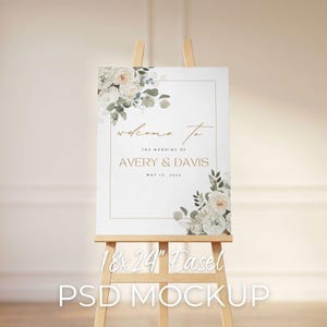 May include: A white wedding sign on a wooden easel. The sign reads "welcome to THE WEDDING OF AVERY & DAVIS MAY 16, 2024." Floral arrangements adorn the corners. The easel is 18x24 inches. The words "18x24" Easel PSD MOCKUP" are at the bottom.