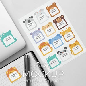May include: A sheet of animal-themed stickers with the text "This book belongs to" on each. Designs include a bear, monkey, giraffe, panda, and more. The word "Sticker" and "MOCKUP" are also visible.