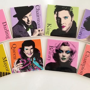 May include: Eight square ceramic coasters with colorful pop art portraits of famous people. Each coaster has a title, such as "Darling", "Chairman", "King", "Force", "Queen", "Beauty", "Champion", and "Mayor".