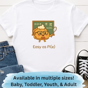 May include: White t-shirt featuring a cartoon pie character with glasses holding a spoon, and a chalkboard with math symbols. The text "Easy as Pi(e)" is below the graphic. The shirt is paired with blue jeans and black sneakers.