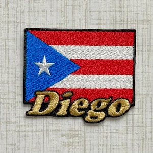 May include: A rectangular embroidered patch featuring the flag of Puerto Rico with a blue triangle, a white star, and alternating red and white horizontal stripes. The name Diego is embroidered in gold thread with a black outline at the bottom.