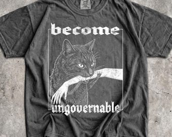 Become Ungovernable T-Shirt - Men & Women's Unisex Graphic Tee - Vintage Funny Meme Tee - Political Tee - Cat Biting Hand Shirt - Gag Shirt