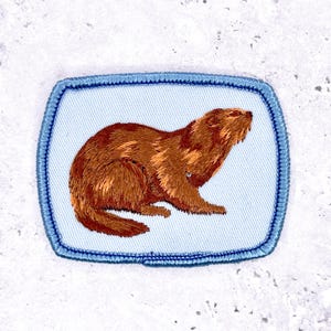 May include: A set of three ceramic mugs with a speckled, matte finish. The mugs are in shades of cream, light gray, and dark gray. Each mug has a simple, minimalist design, perfect for coffee or tea.