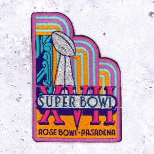May include: Embroidered patch featuring the Super Bowl XVI logo. The patch has a purple border and a design with a football trophy, the words "SUPER BOWL XVI", and "ROSE BOWL - PASADENA" in a retro color scheme.