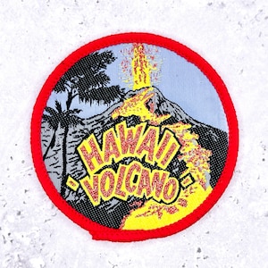 May include: Circular patch with a red border featuring a volcano erupting with yellow lava. The patch has a light blue background with palm trees and the words "HAWAII VOLCANO" in yellow and red.