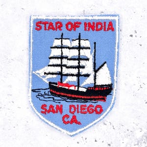 May include: A set of three ceramic mugs with a speckled, matte finish. The mugs are in shades of cream, light gray, and dark gray. Each mug has a simple, minimalist design, perfect for coffee or tea.