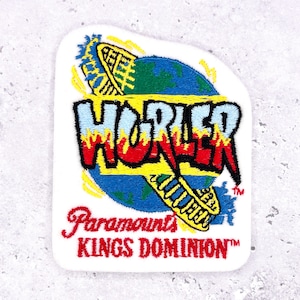 May include: Embroidered patch featuring the word "HORLER" in red and yellow flame-like letters, above a blue and green globe design. The patch also includes the text "Paramount's KINGS DOMINION" in red script on a white background.
