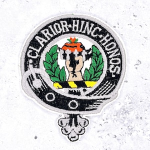 May include: Embroidered patch with the text "CLARIOR HINC HONOS" in a circular design. The patch features a central emblem with green leaves, a figure, and orange and yellow accents, all set against a white background.