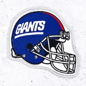 May include: Embroidered patch featuring a blue football helmet with the word "GIANTS" in white. The helmet has a red stripe and a white facemask. The patch has a silver border.
