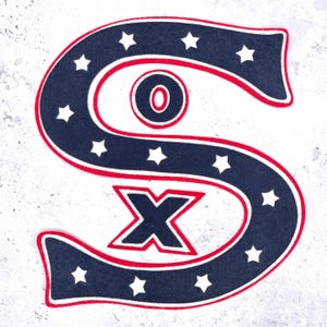 May include: A navy blue and red decorative emblem in the shape of a large letter "S" with the letters "O" and "X" inside. The "S" is outlined in red and has white stars along the edges.