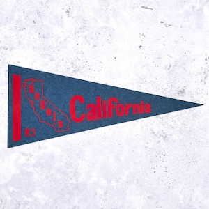 May include: A navy blue pennant with the word "California" in red, along with a red outline of the state and the word "Angels" inside. The pennant is triangular and made of felt.