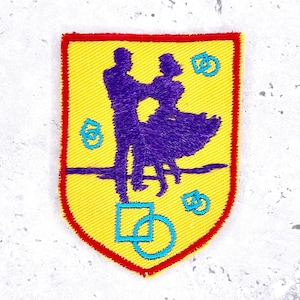 May include: A white ceramic mug with a black handle and the text "But First, Coffee" in a handwritten style. The mug is on a white surface. The mug is approximately 4 inches tall.