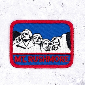 May include: A set of three ceramic mugs with a speckled, matte finish in cream, light grey, and dark grey. Each mug has a simple, minimalist design, ideal for coffee or tea.