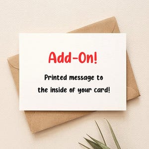 Op de afbeelding: Een witte kaart met de rode tekst "Add-On!" ligt op een bruine envelop. Daaronder staat "Printed message to the inside of your card!". De kaart en envelop liggen op een lichtbeige oppervlak.