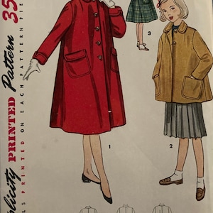 May include: Vintage Simplicity sewing pattern for a girls' coat. The pattern is for size 12 and includes three different styles. The first style is a red coat with a collar and pockets. The second style is a brown coat with a collar and pockets. The third style is a plaid coat with a collar and pockets.