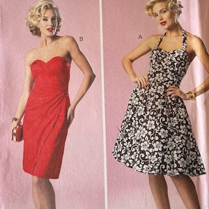 May include: Butterick B6019 sewing pattern featuring two vintage-style dresses. One is a red strapless dress, and the other is a halter dress with a black and white floral print. The pattern includes sizes 12-20.
