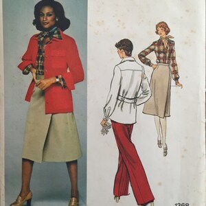 May include: A vintage Vogue American Designer sewing pattern for a red jacket, white blouse, and beige skirt. The pattern is for size 1368 and is designed by Calvin Klein.