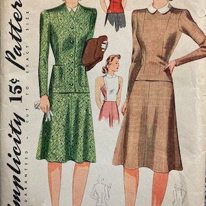 May include: Vintage Simplicity sewing pattern number 3907, size 12, bust 30. The pattern is for a dress with a fitted bodice and a full skirt. The dress is shown in two different fabrics, one green and one brown. The pattern is guaranteed to be cut to exact size.