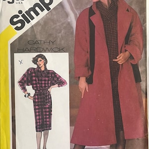May include: Simplicity sewing pattern number 6572 for a coat and dress. The pattern is designed by Cathy Hardwick and includes a special chart on how to work with plaids.